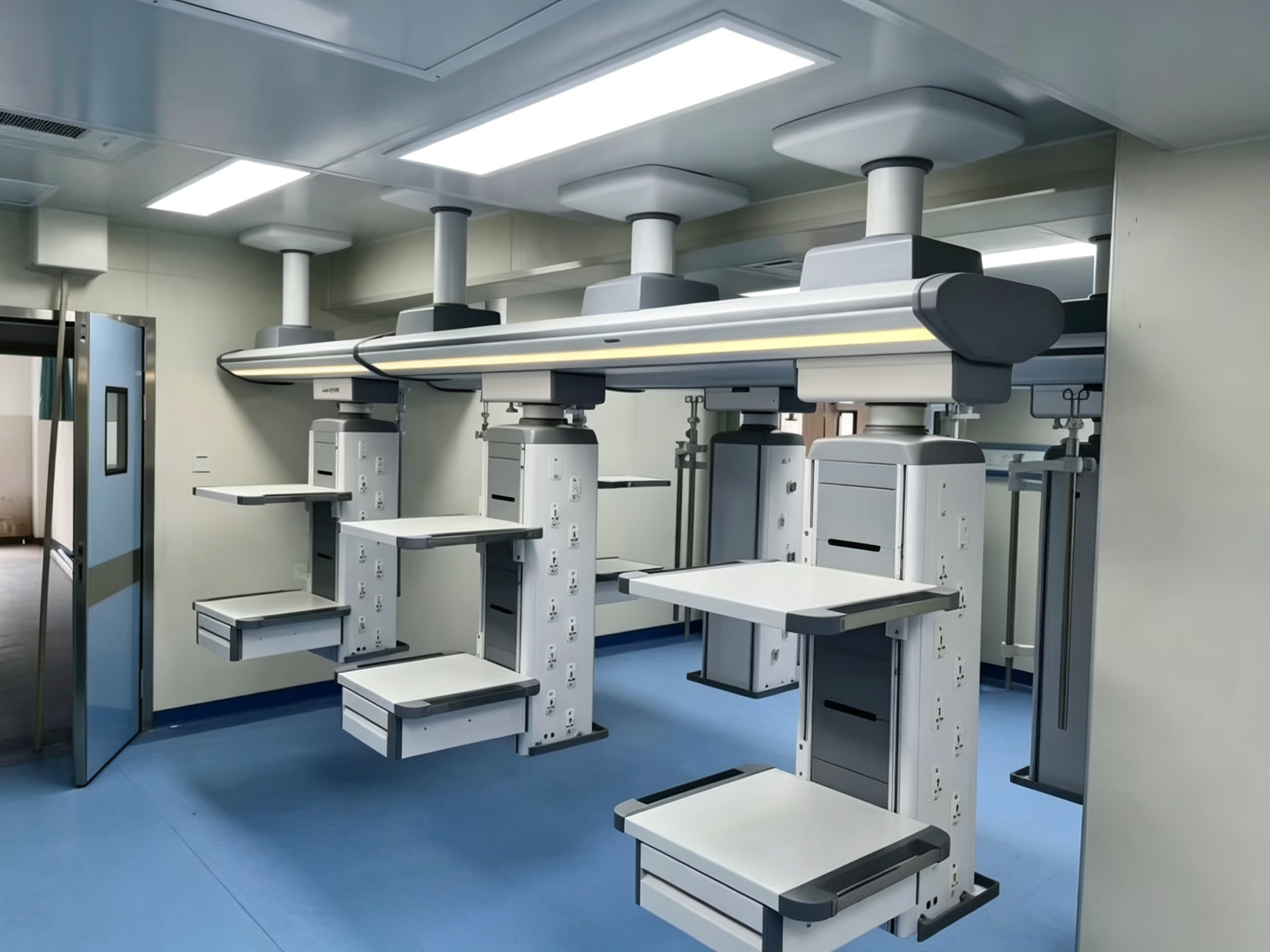 Ceiling-mounted medical pendant installed above a hospital bed with gas outlets and shelves