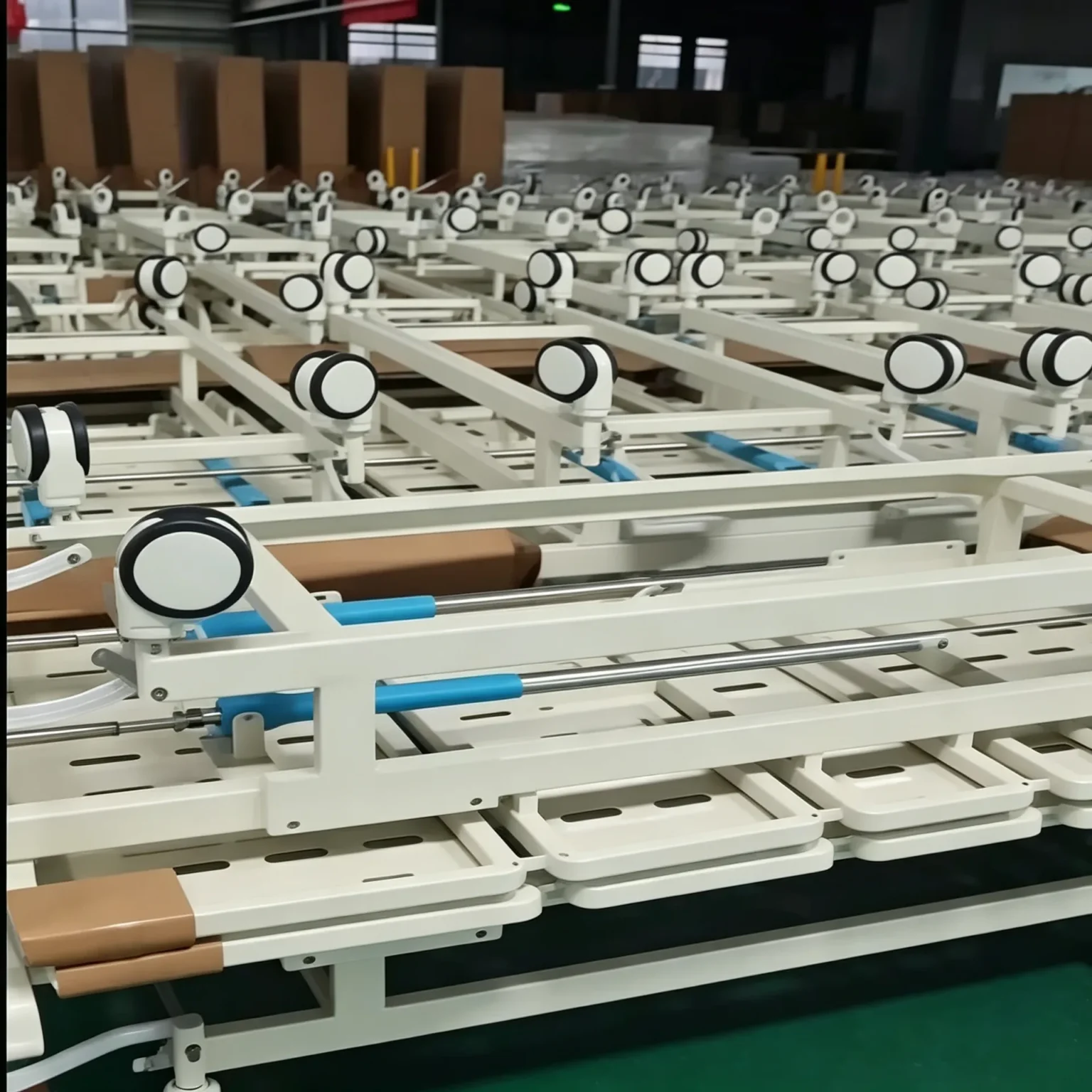 Hospital bed central locking pedal and 5-inch polyurethane casters during factory assembly