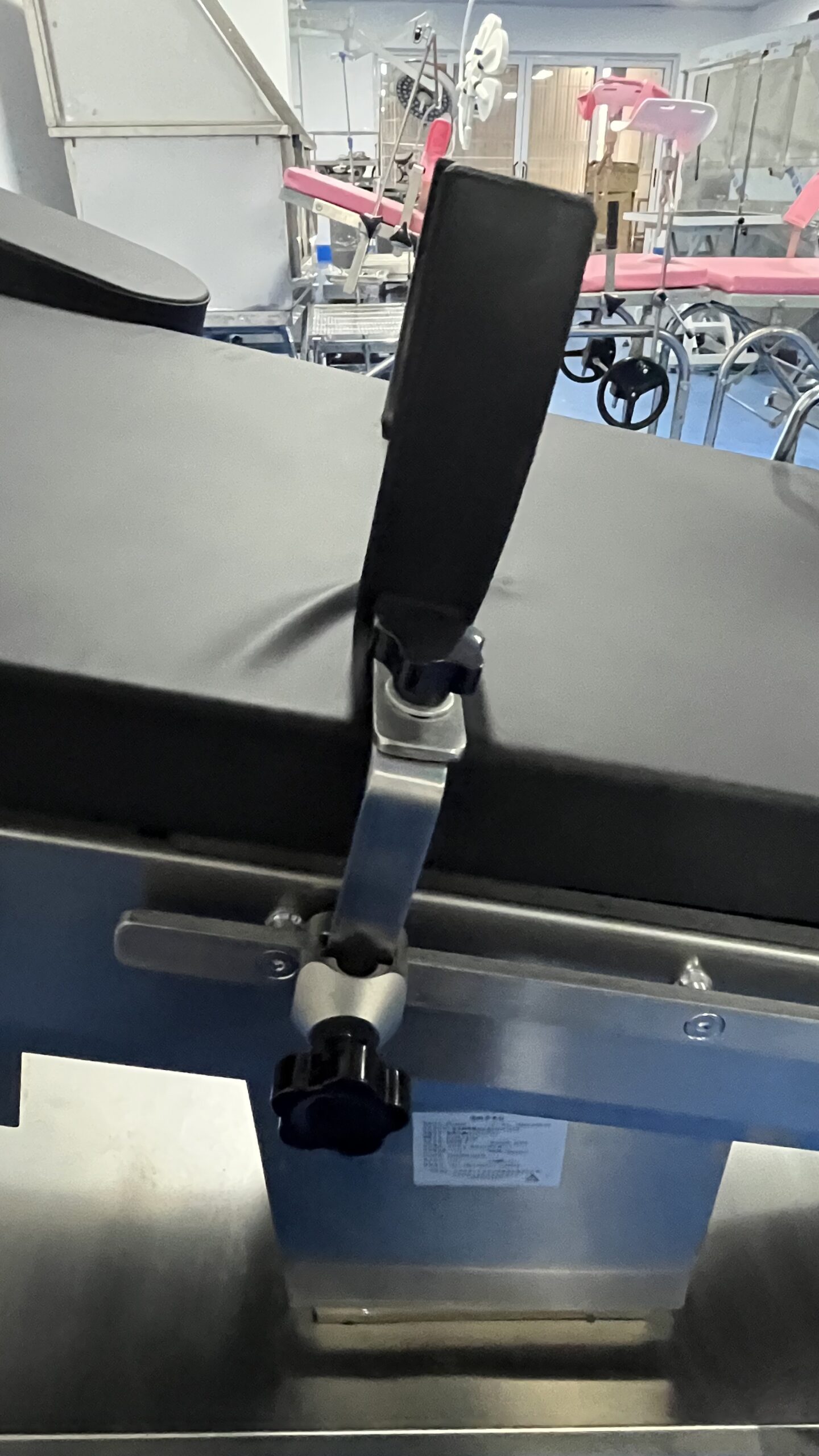 Operating table undergoing preventive maintenance checks on actuators, brakes, and controls