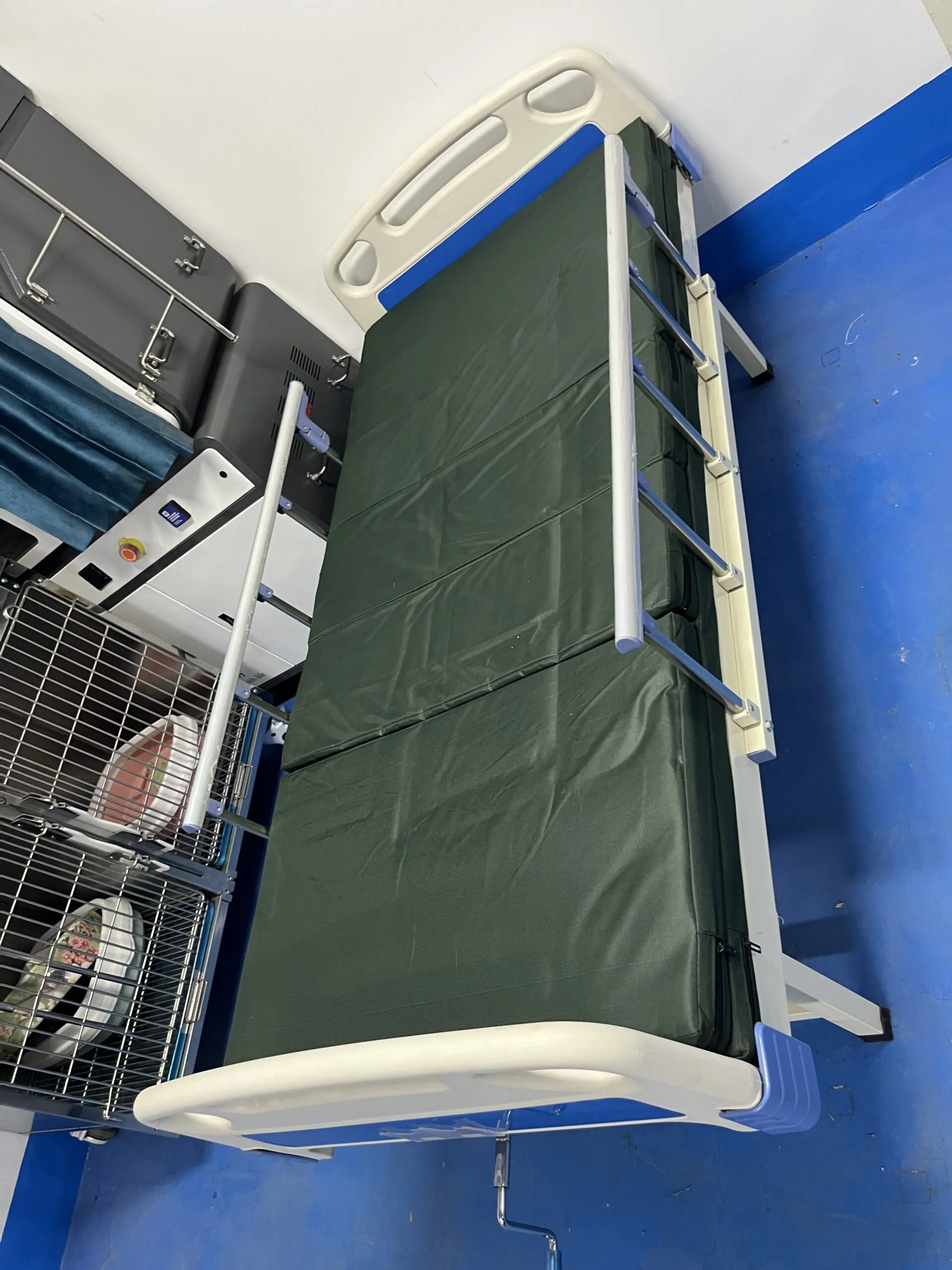Five-function electric ICU hospital bed with split ABS side rails and nurse control panel