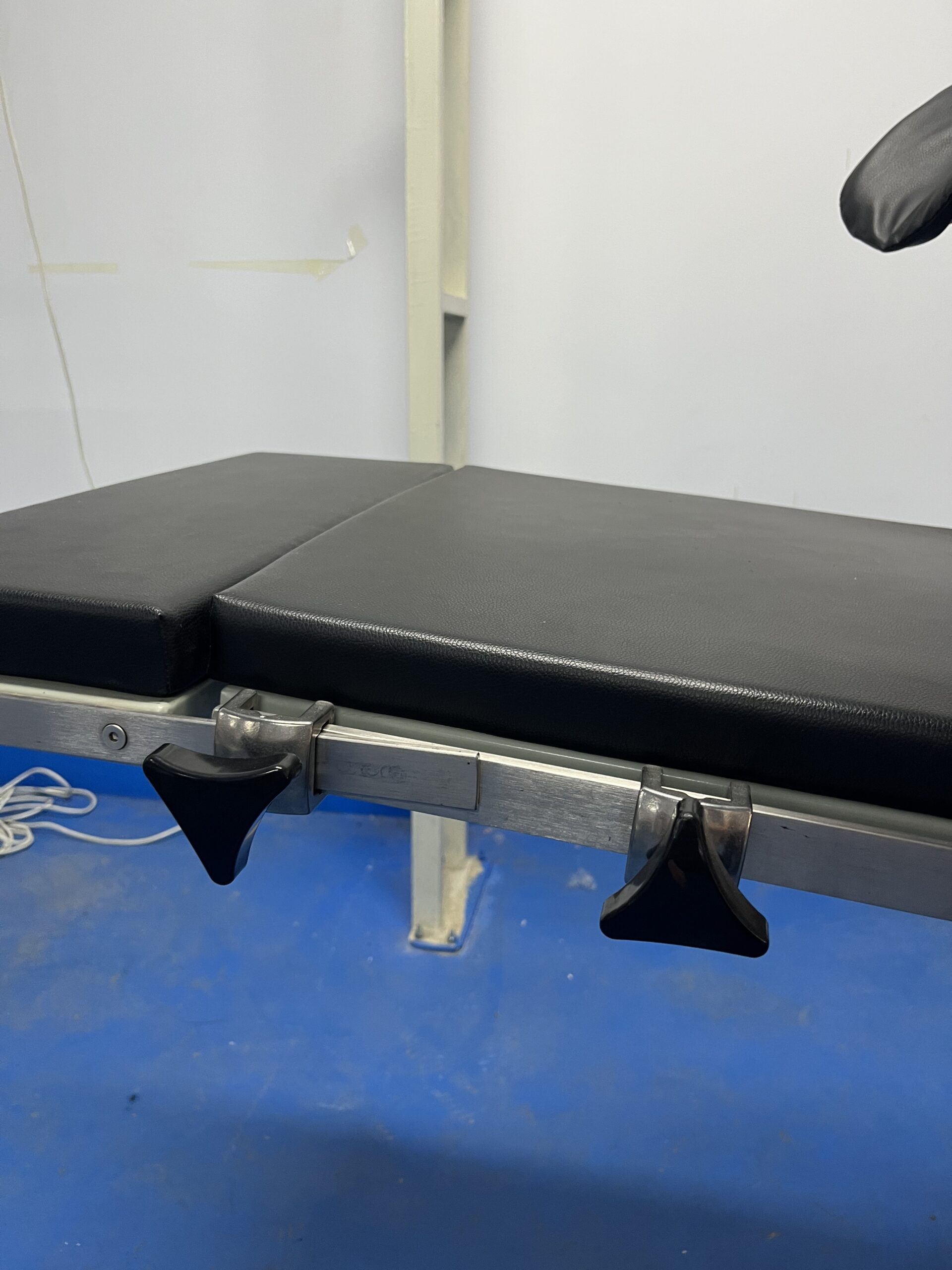 Operating table with modular top sections for multi-specialty surgical use