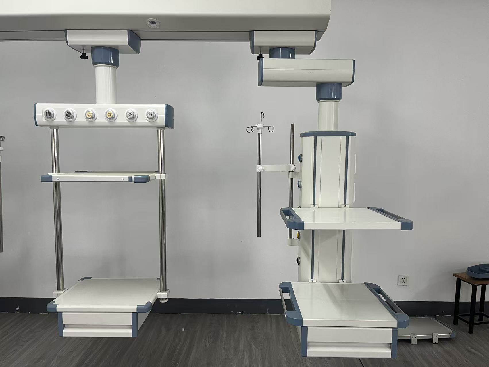 Ceiling-mounted medical pendant arm undergoing loaded drift test during OR commissioning