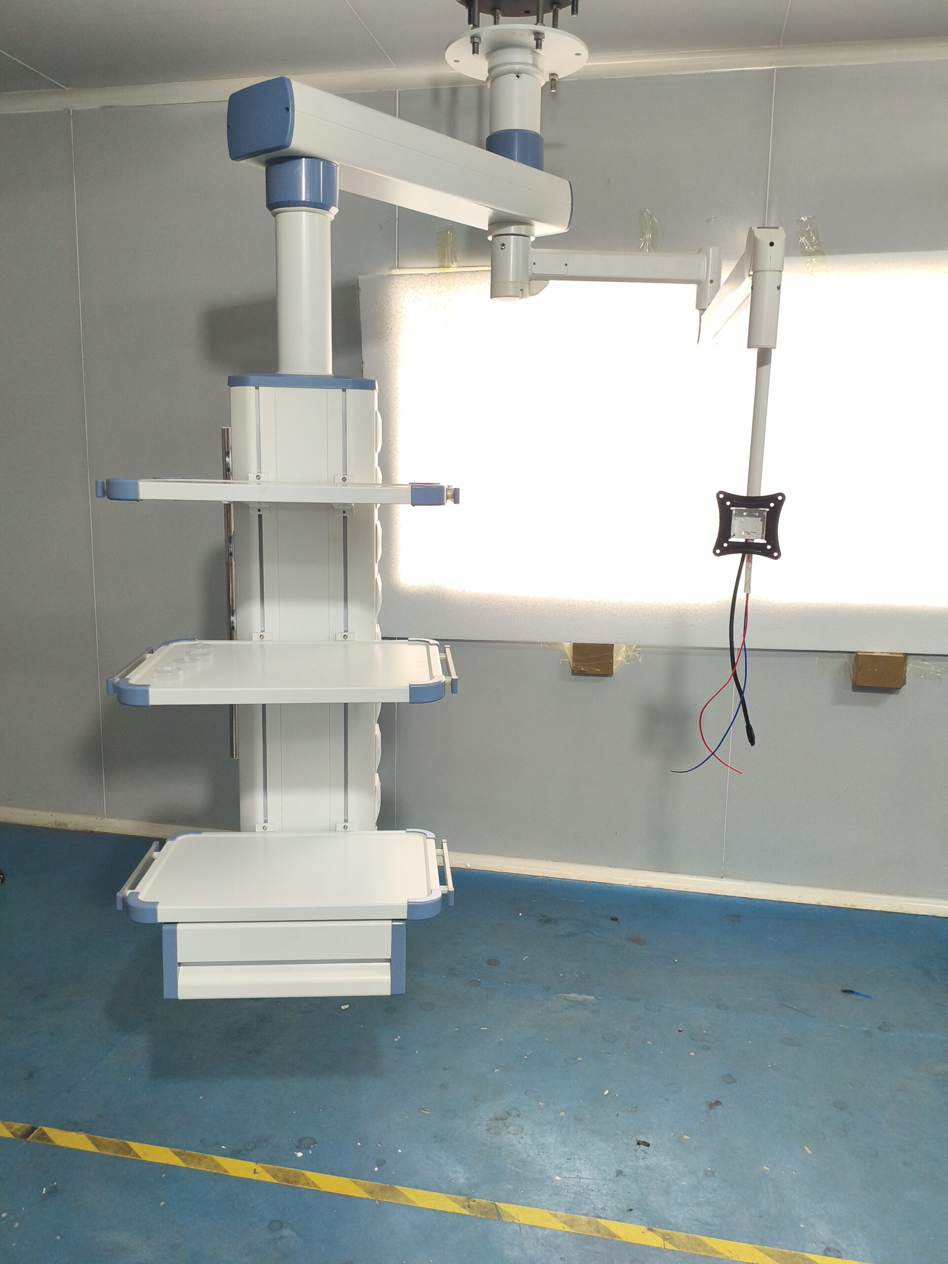 Medical pendant with accessory shelves, drawers, and infusion pump brackets