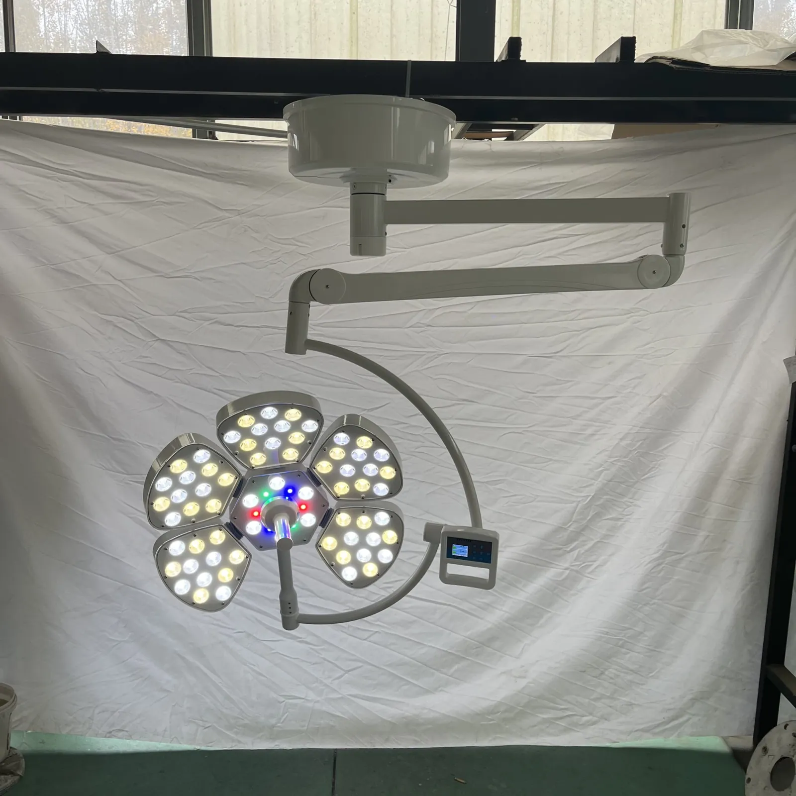 LED surgical light head detail showing the modular multi-lens array used for shadow dilution