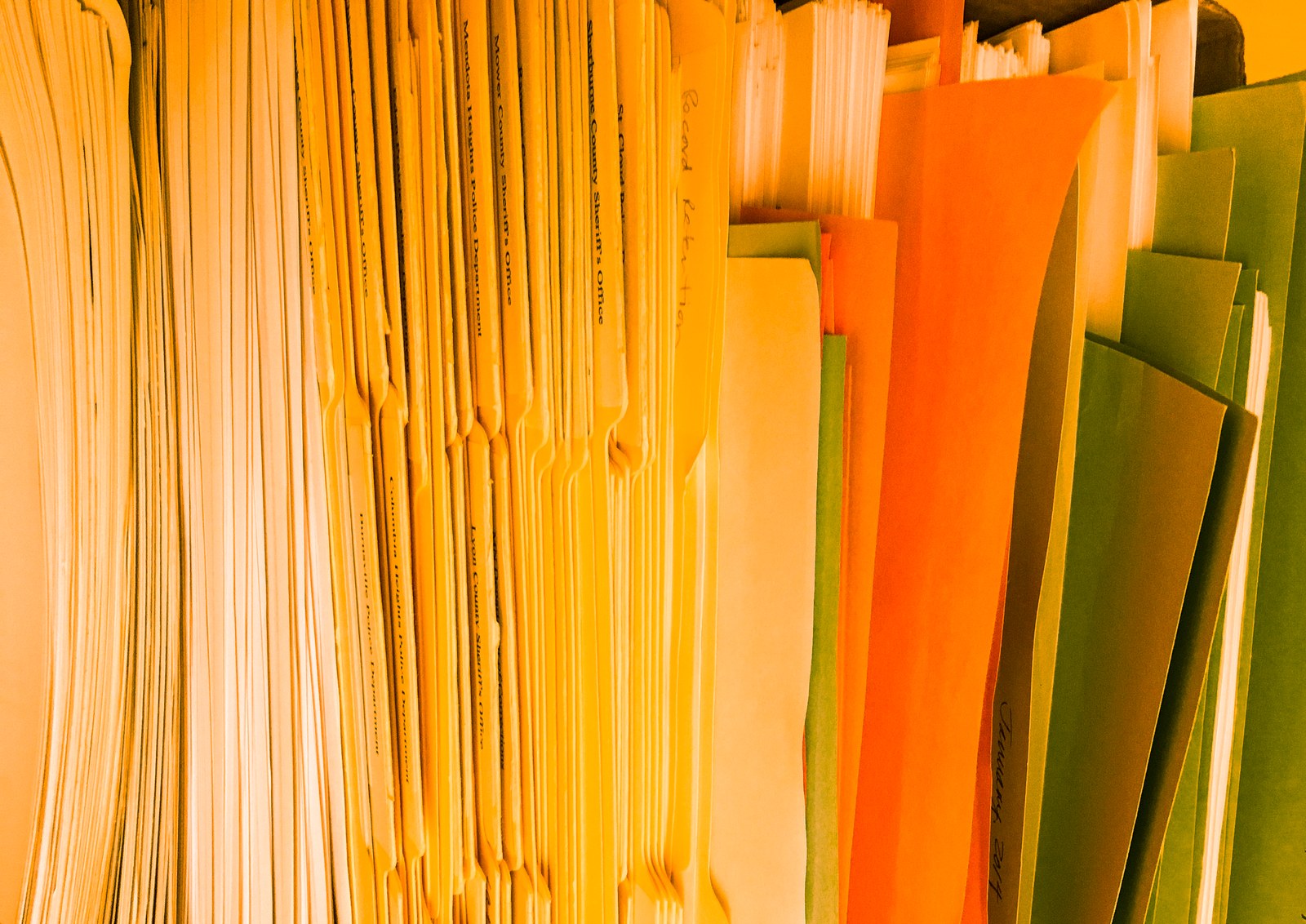 File folders of printed equipment records used to keep a per-accessory fit, cleaning and inspection history
